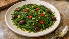 Agretti in padella con olive taggiasche: pronti in 5 minuti, restano verdi