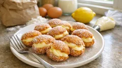 Zeppoline di Carnevale alla crema: bignè fritti leggeri, dorati e pieni di crema